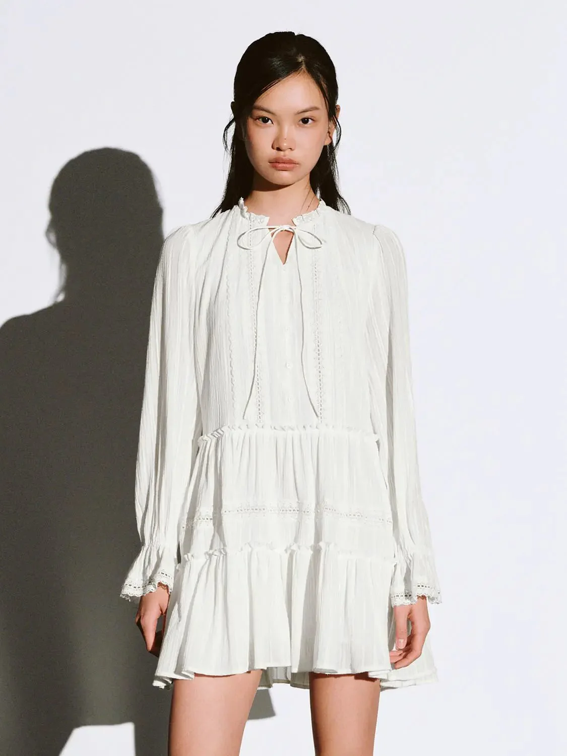 12507-white-cotton-tiered-long-sleeve-lace-trim-dress-1.webp White Cotton Tiered Long Sleeve Lace Trim Dress