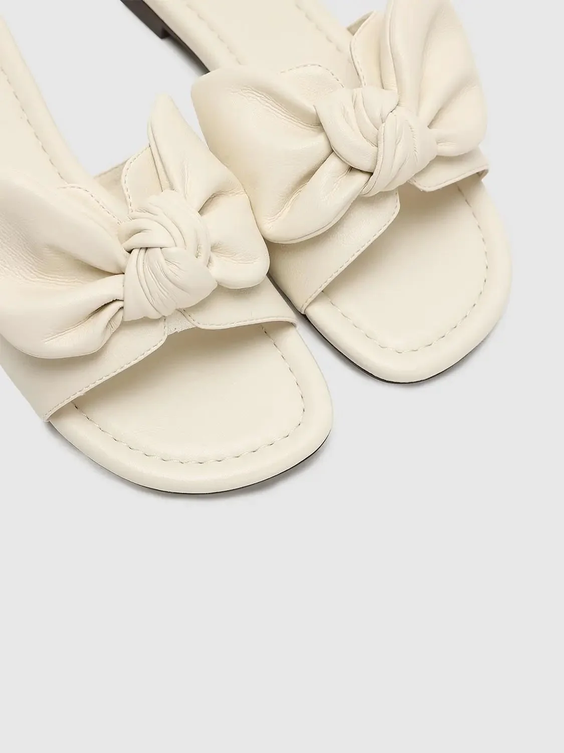 14783-faux-leather-bow-detail-slippers-6.webp Faux Leather Bow Detail Slippers