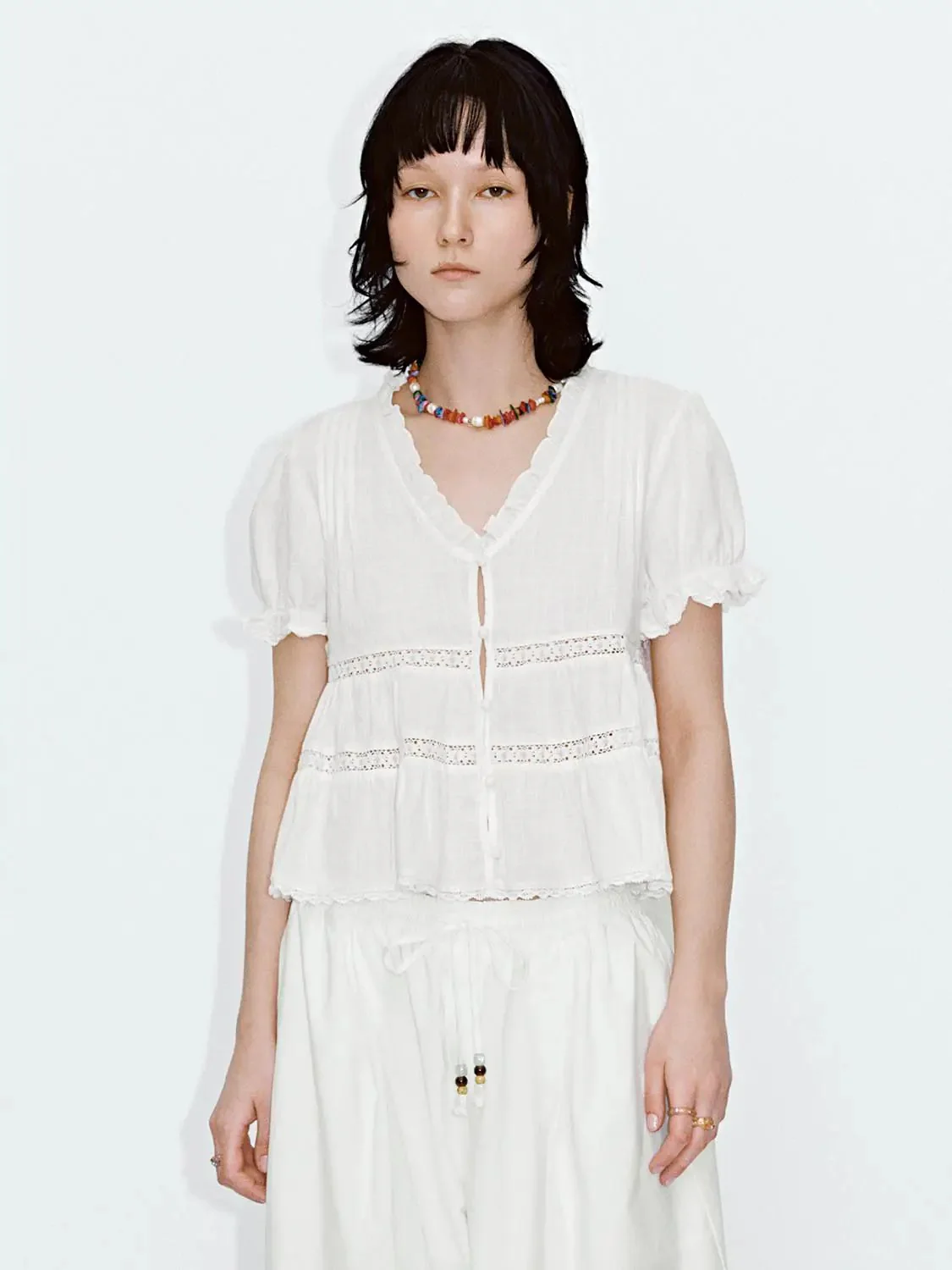 15221-ruffle-trim-lace-detail-v-neck-shirts-1.webp Ruffle Trim Lace Detail V-Neck Shirts