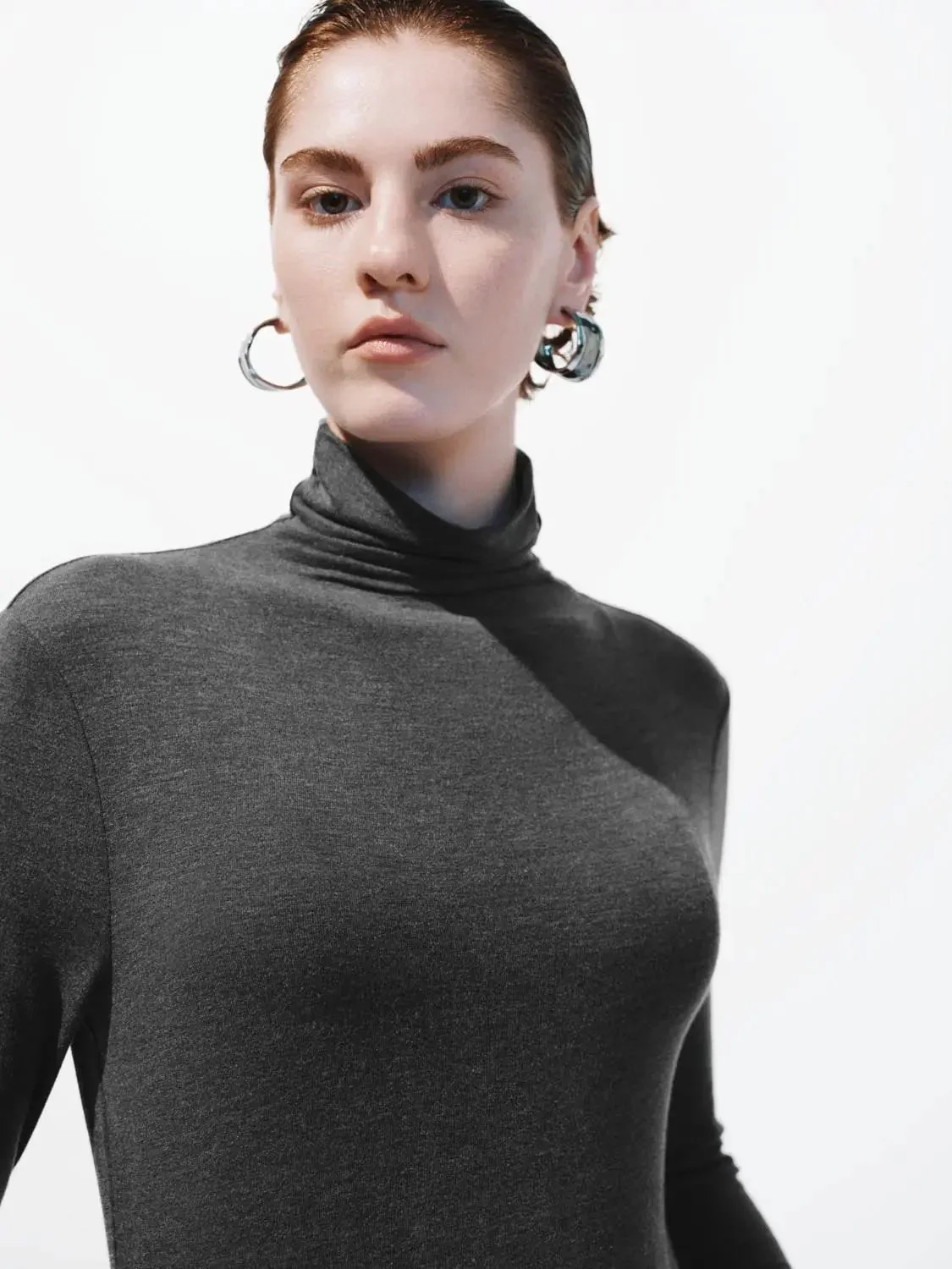 16221-minimalist-black-soft-knit-high-neck-long-sleeve-top-27.webp Minimalist Black Soft Knit High Neck Long Sleeve Top