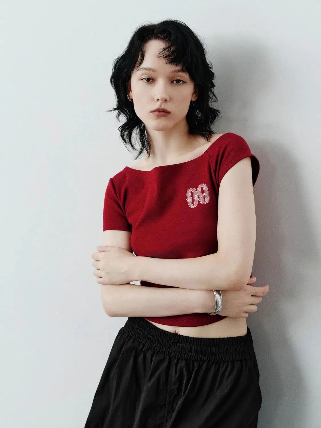 17974-cotton-sloped-shoulder-graphic-print-skinny-fit-t-shirts-2.webp Cotton Sloped Shoulder Graphic Print Skinny-Fit T-Shirts