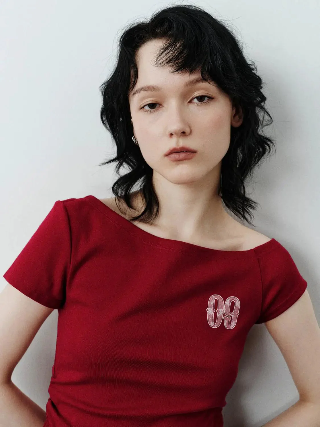 17974-cotton-sloped-shoulder-graphic-print-skinny-fit-t-shirts-3.webp Cotton Sloped Shoulder Graphic Print Skinny-Fit T-Shirts