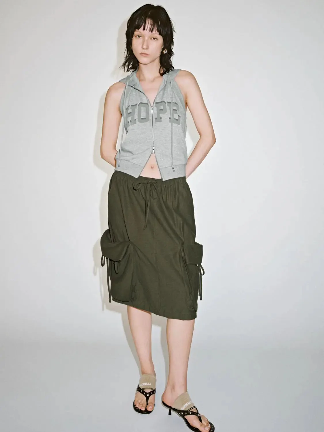 18535-olive-cotton-drawstring-cargo-flap-pockets-midi-skirts-6.webp Olive Cotton Drawstring Cargo Flap Pockets Midi Skirts