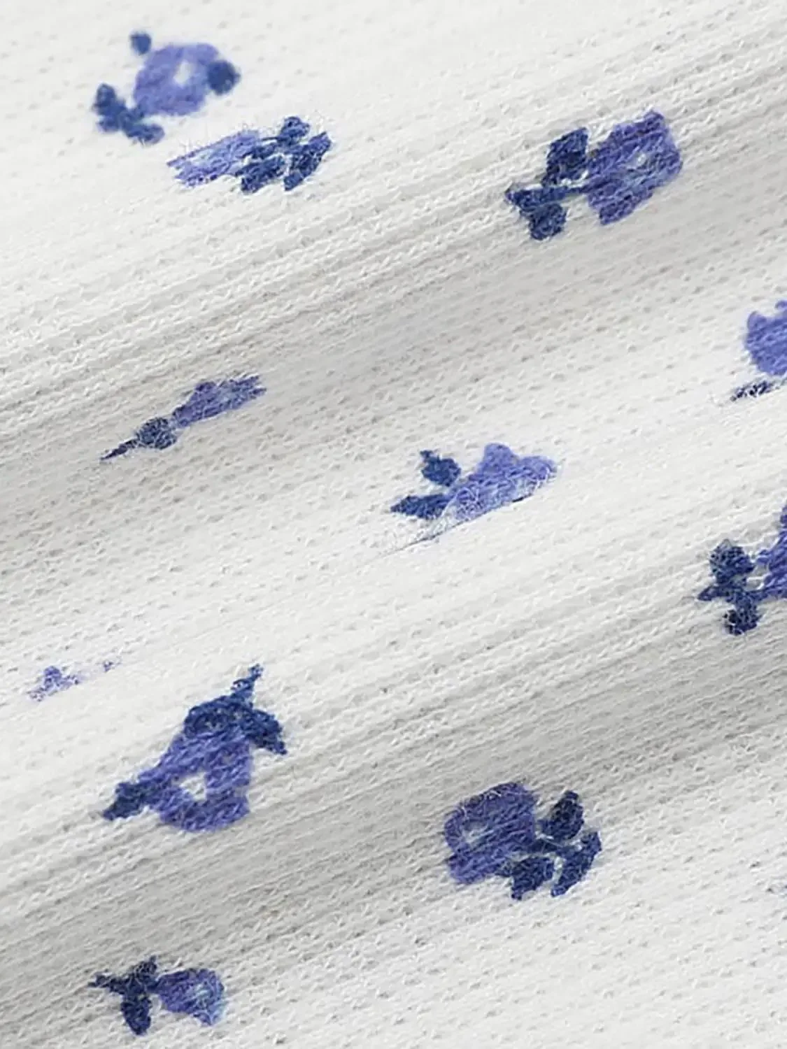 20180-white-cotton-printed-strappy-blue-floral-tank-top-3.webp White Cotton Printed Strappy Blue Floral Tank Top