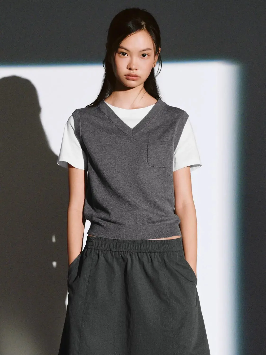 20599-cotton-knit-with-slim-v-neck-and-pocket-vest-1.webp Cotton Knit With Slim V-Neck And Pocket Vest