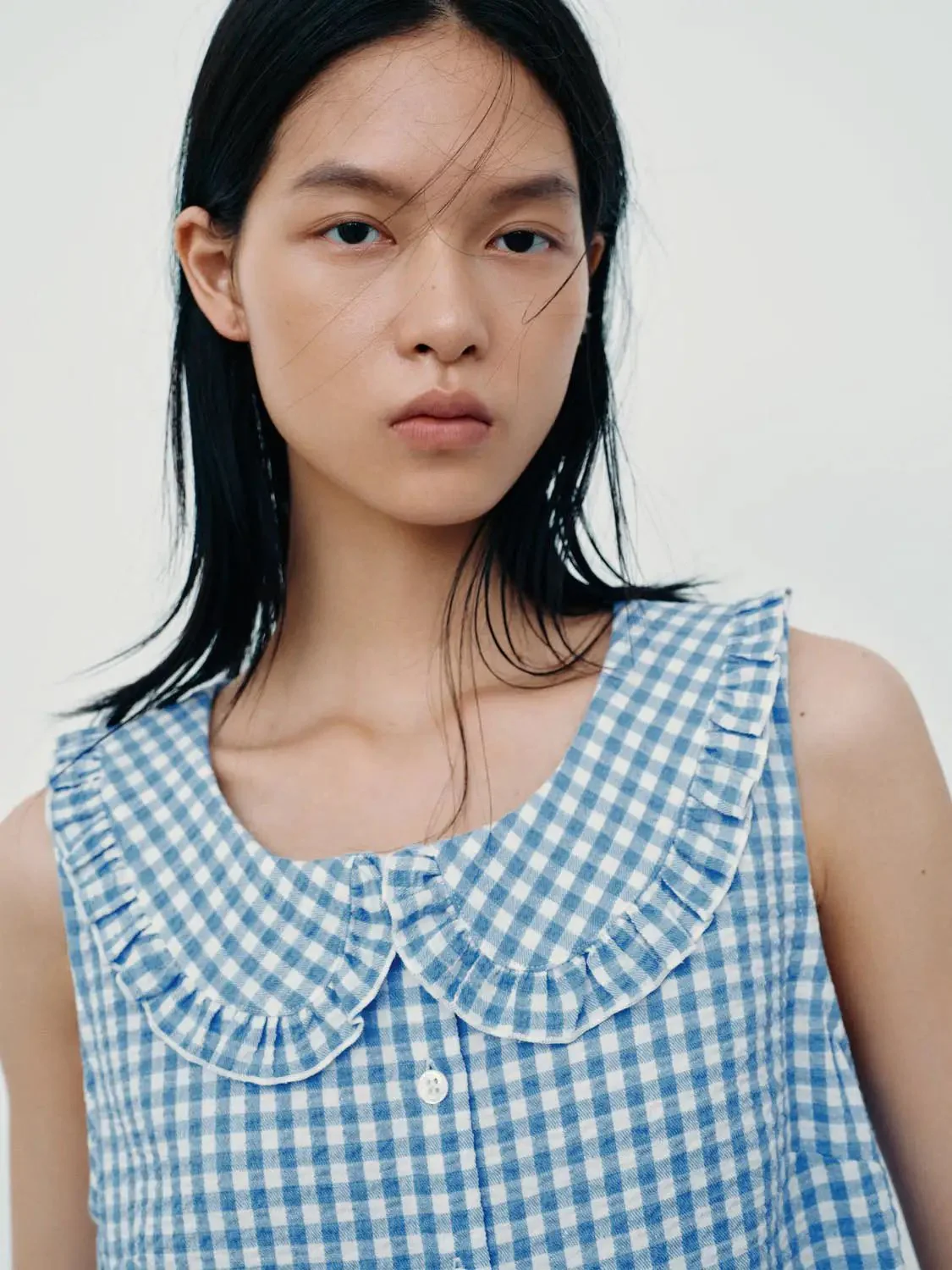 20907-contrast-check-ruffle-trim-sleeveless-shirts-3.webp Contrast Check Ruffle Trim Sleeveless Shirts