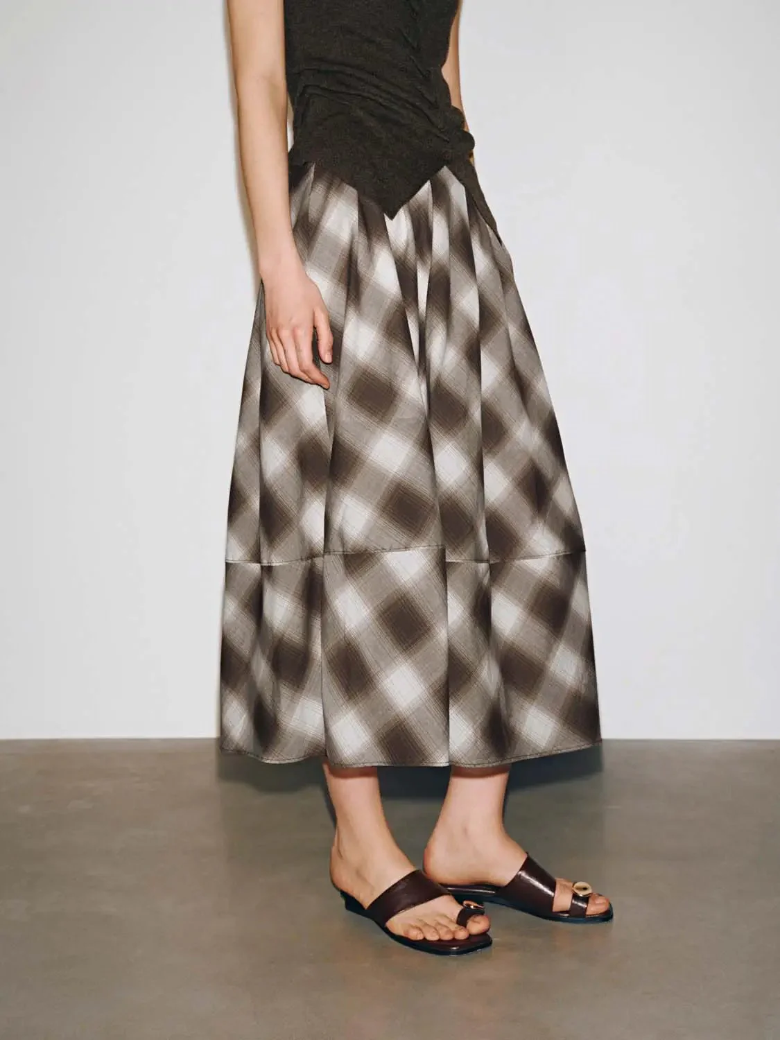 21188-check-pleated-a-line-midi-skirts-3.webp Check Pleated A-Line Midi Skirts