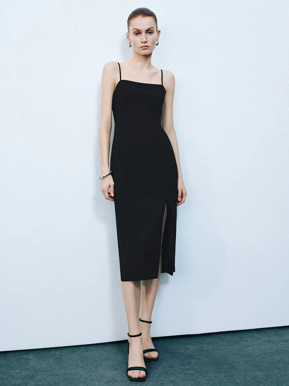 24189-black-spaghetti-strap-midi-sleek-stretch-slit-dress-1.webp Black Spaghetti Strap Midi Sleek Stretch Slit Dress