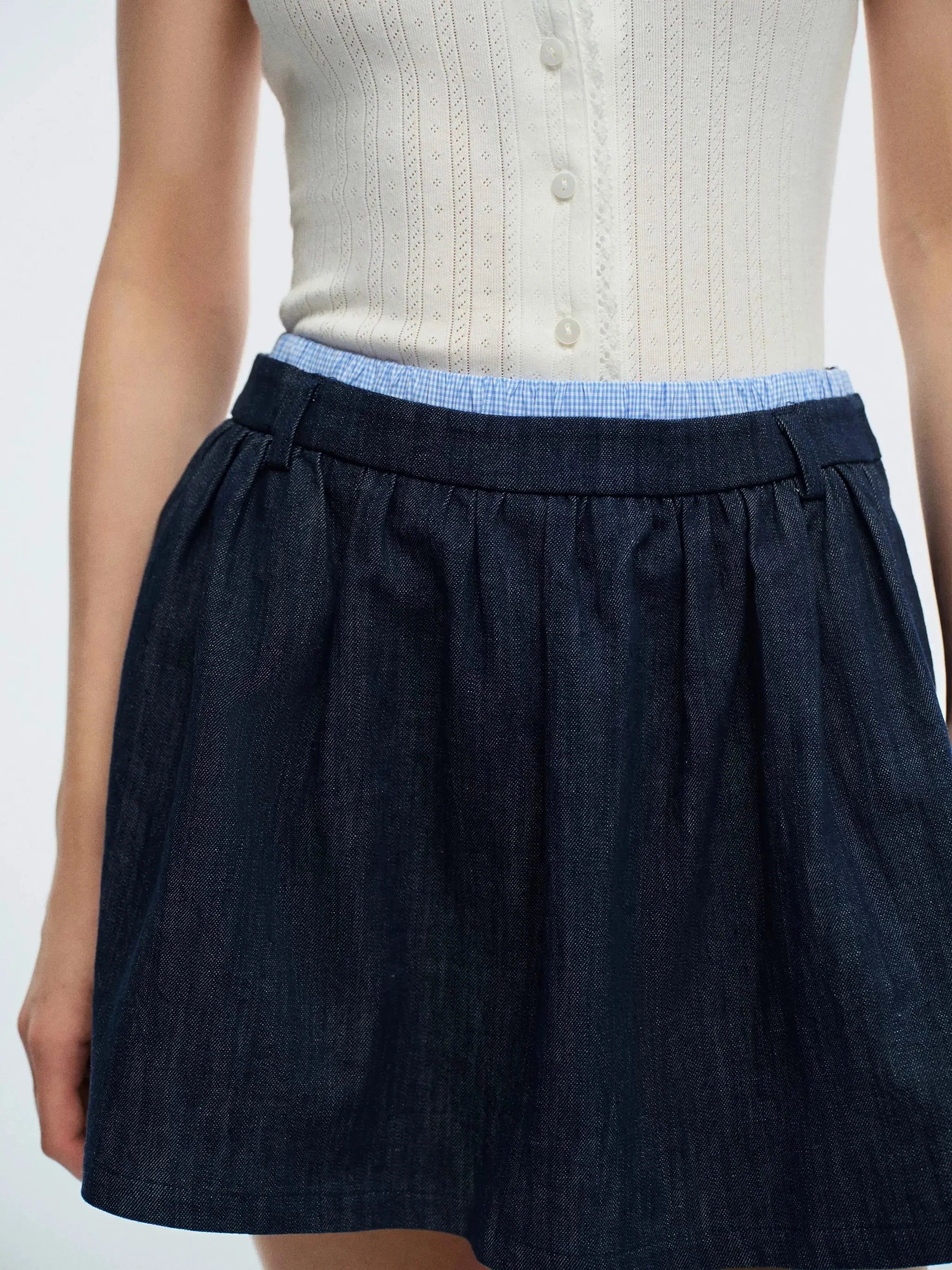 5064-dark-wash-denim-with-subtle-contrast-trim-mini-skirts-6.webp Dark Wash Denim With Subtle Contrast Trim Mini Skirts