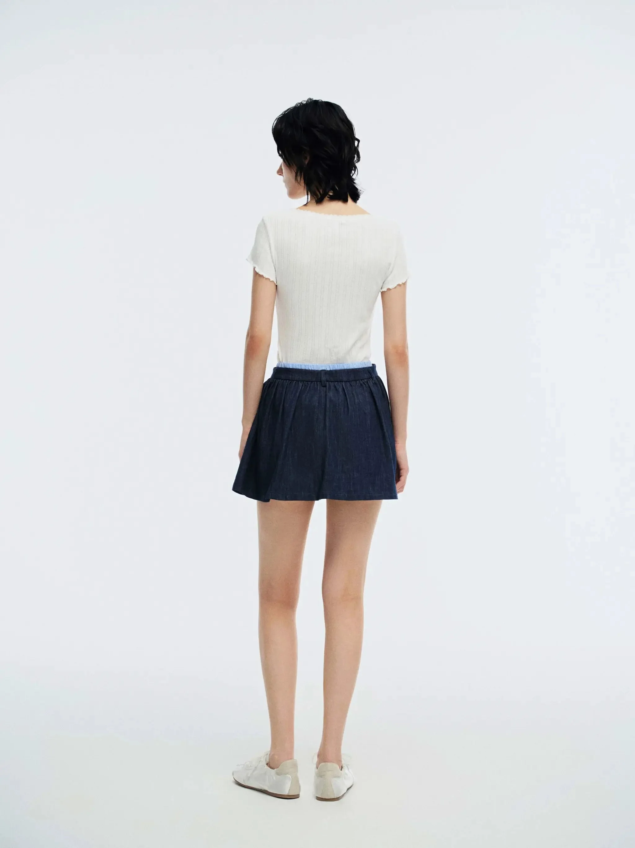 5064-dark-wash-denim-with-subtle-contrast-trim-mini-skirts-7.webp Dark Wash Denim With Subtle Contrast Trim Mini Skirts