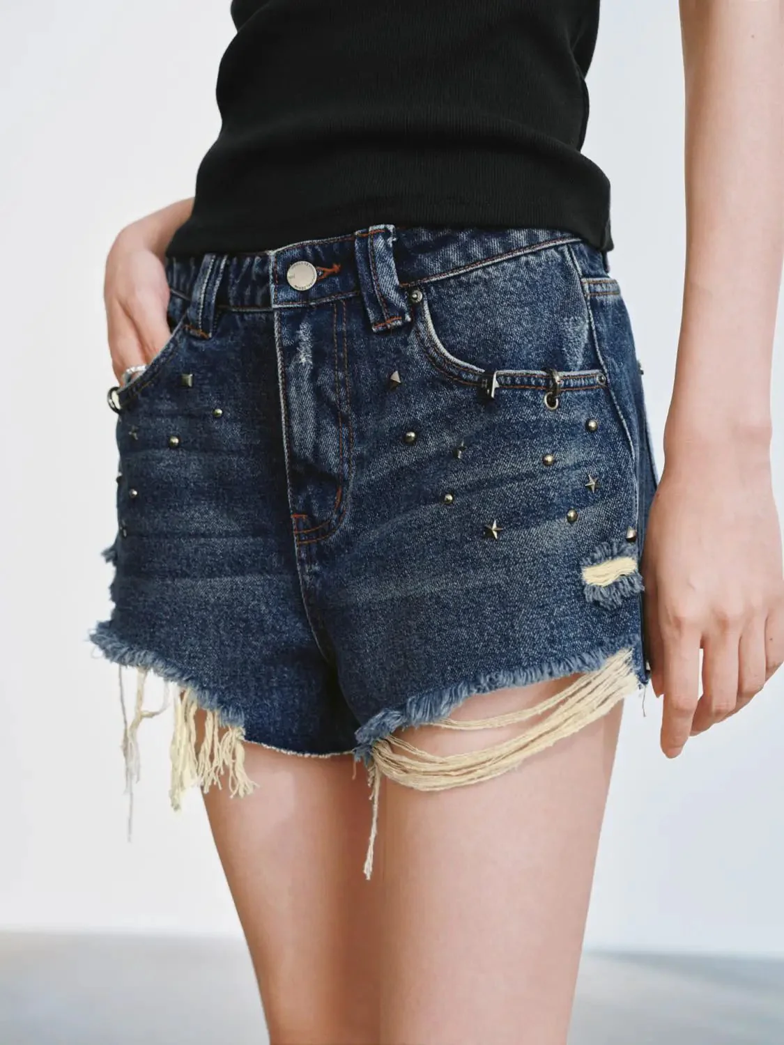 5108-distressed-denim-with-raw-hem-and-studded-detailing-shorts-5.webp Distressed Denim With Raw Hem And Studded Detailing Shorts