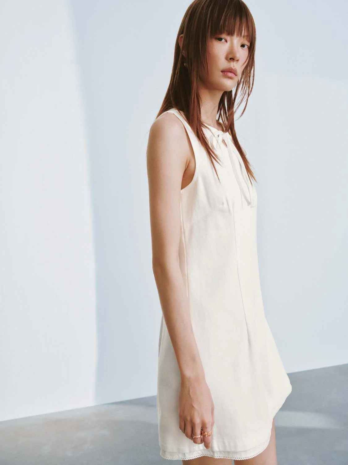 5450-sleeveless-tie-detail-denim-mini-dresses-2.webp Sleeveless Tie Detail Denim Mini Dresses