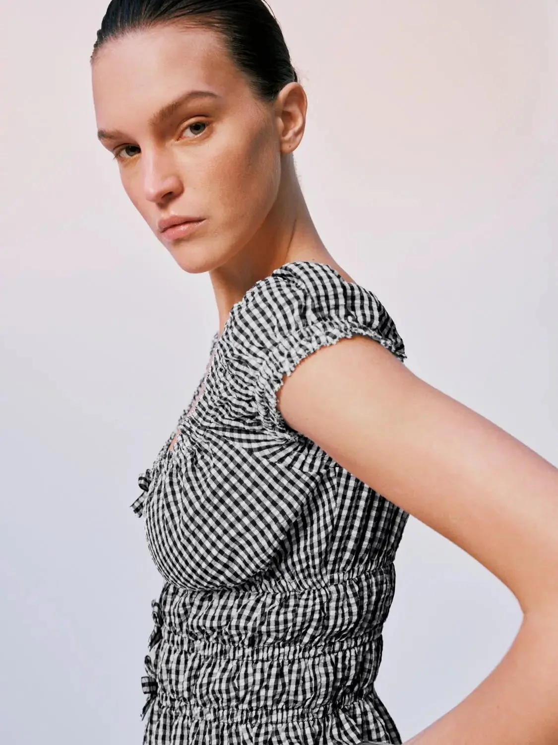 8828-gingham-polyester-shirred-peplum-ruffle-cap-sleeve-overhead-shirts-3.webp Gingham Polyester Shirred Peplum Ruffle Cap Sleeve Overhead Shirts